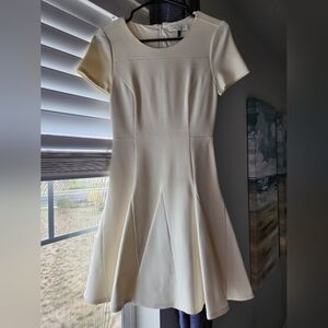 Cream colored mid thigh length dress